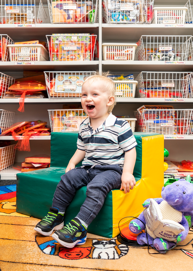 Child sitting in a play room