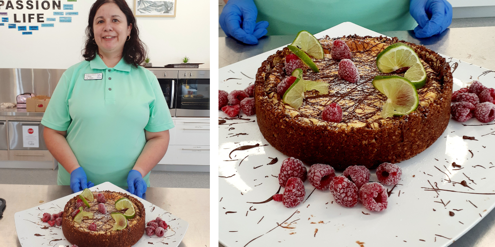 Two photos side by side, in the left photo there is a lady from CPL Hope Island with a light green polo shirt, blue latex gloves and long brown hair standing in a kitchen. She is holding a Key Lime Pie drizzled with dark chocolate with raspberries and lime slices on top. The right photo shows a close up on the Key Lime Pie. 